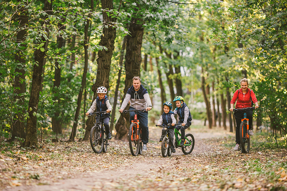 Family biking on a trail